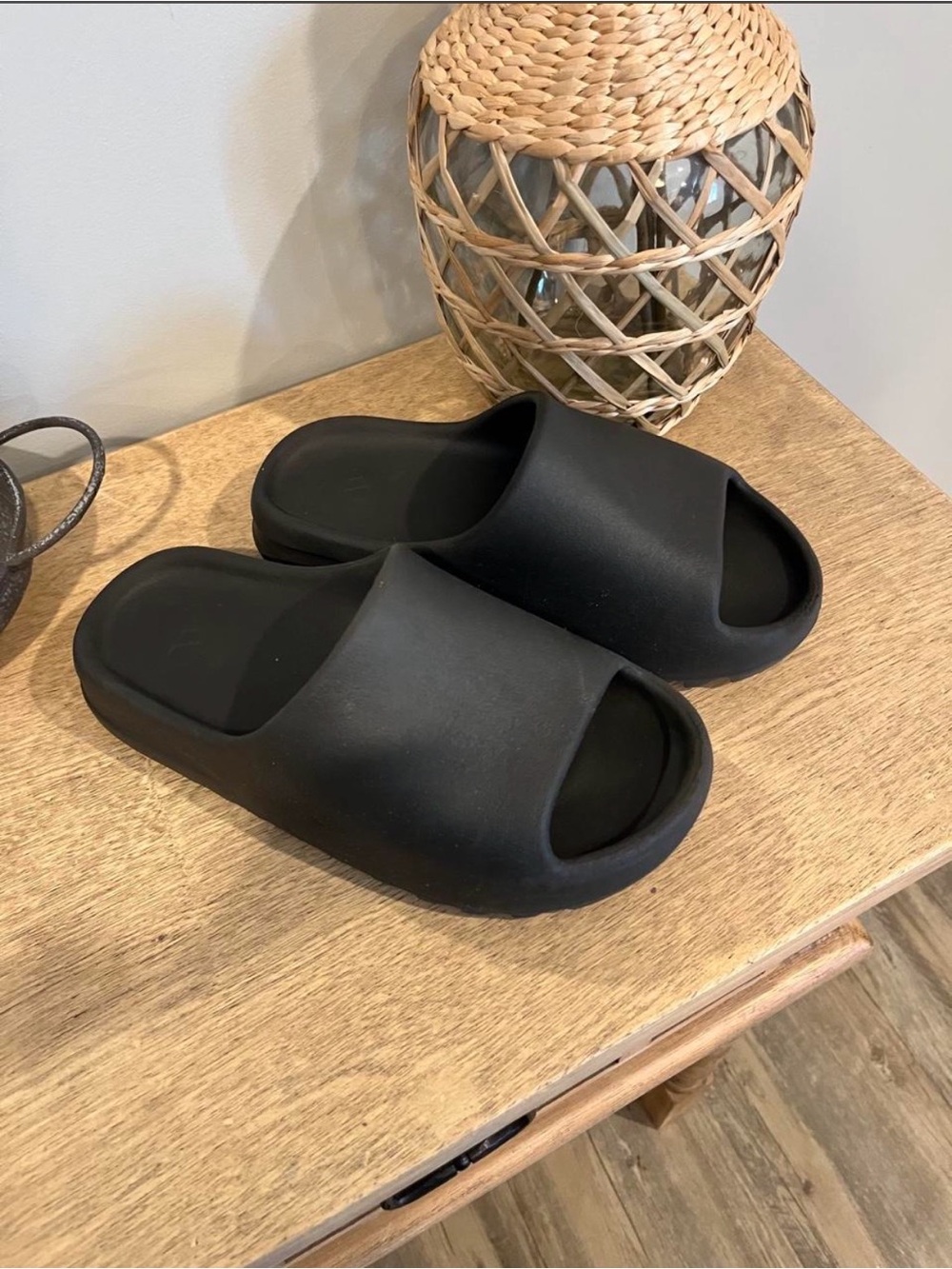Yeezy Slides in the "Onyx" colorway slides